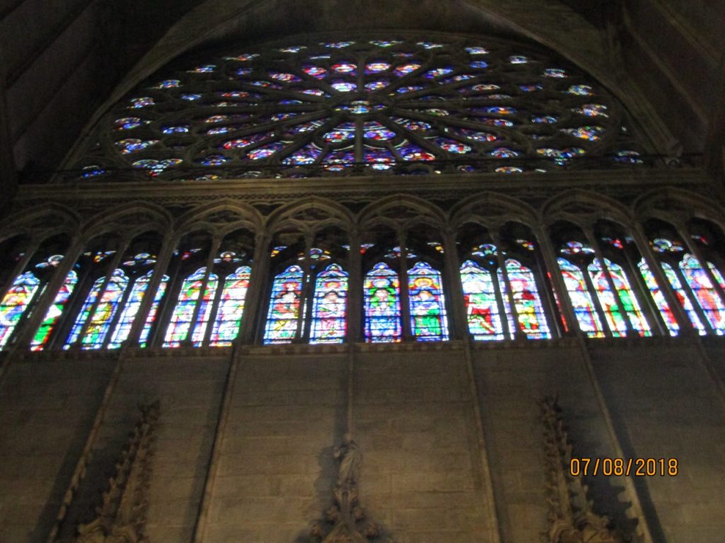 Looking up towards a beautiful S rose window of Notre Dame Cathedral-photo by Lysandra Furstenberg