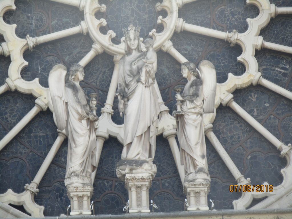 Unique photos of Notre-Dame de Paris Cathedral before the April 2019 fire - Notre Dame Cathedral rose window exterior statues - photo by Lysandra Furstenberg