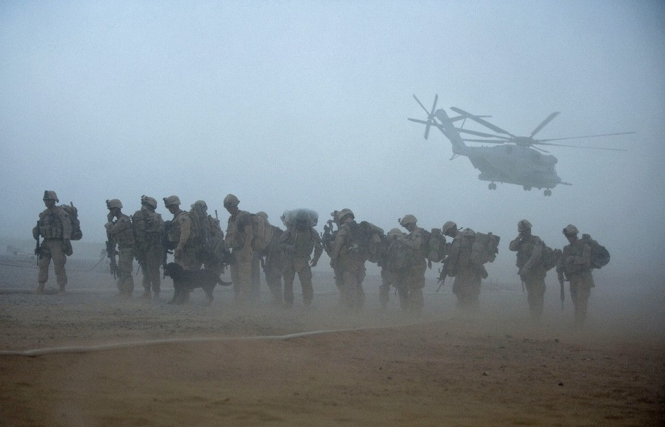U.S. Marines from the 2nd Battalion, 8th Marine Regiment of the 2nd Marine Expeditionary Brigade wait for helicopter transport as part of Operation Khanjar at Camp Dwyer in Helmand Province in Afghanistan on July 2, 2009
