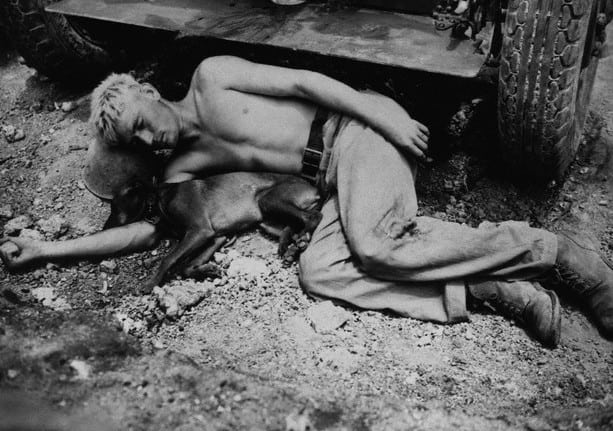 1945, Japan, Okinawa. A soldier and his pet dog.