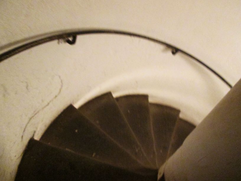 A spiral staircase taking us 20 meters underground into the Catacombs of Paris