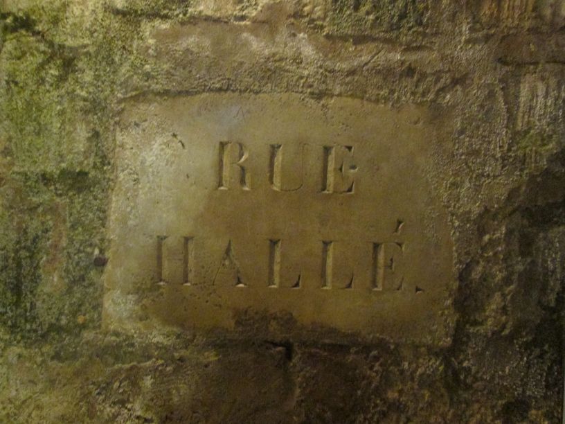 A reminder that we are underneath Rue Hallé in the Catacombs of Paris.