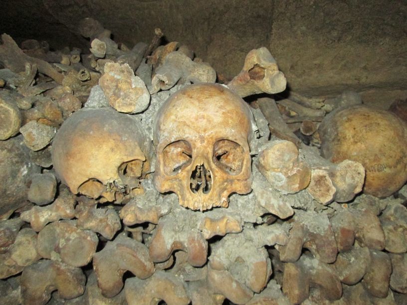 Looking at Skulls in Paris Catacombes