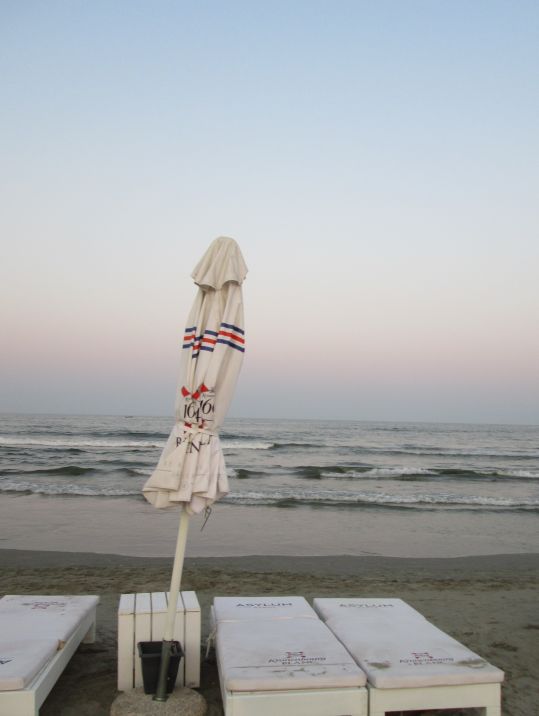 striped beach umbrella by the sea @PatFurstenberg