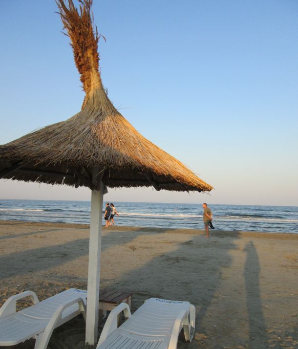 straw beach umbrella by the sea @PatFurstenberg