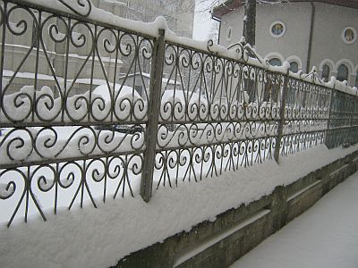 snow on a fence in winter