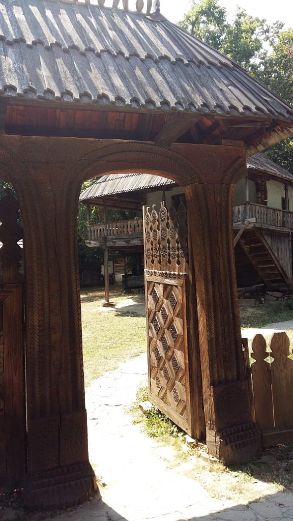 small carved gate with a roof, woodwork Romania