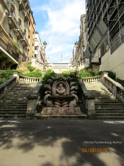 Luis de Camoes statue and twin stairs on Boulevard Delessert, flaneurs in Paris streets