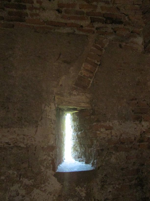 Corvin Castle, Window Slits and Telling Rocks, 100-Word Story, a lone rocky slit window
