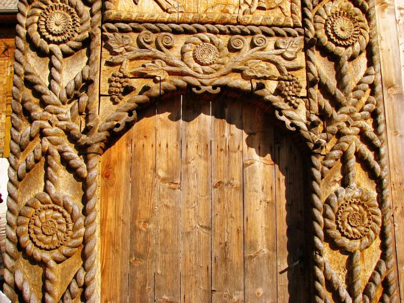 Maramures Szeklers Gates Dreamland, a richly wooden carved Maramures gate that a nemes, richer peasant, could afford
