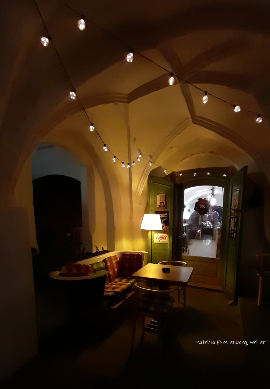 Small Square Sibiu,by night. quaint coffee bench in a bathtub and Christmas lights