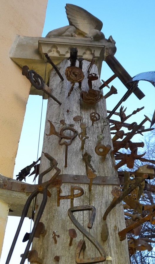Casa Calfelor wooden pillar tools detail tongs keys roses