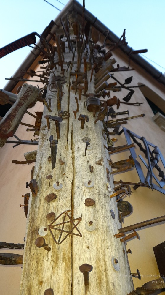 nails tools buttons stuck in the wooden pillar of calfe craftsmen tradition Sibiu