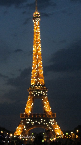 Eiffel Tower by night sparkling like a champagne glass