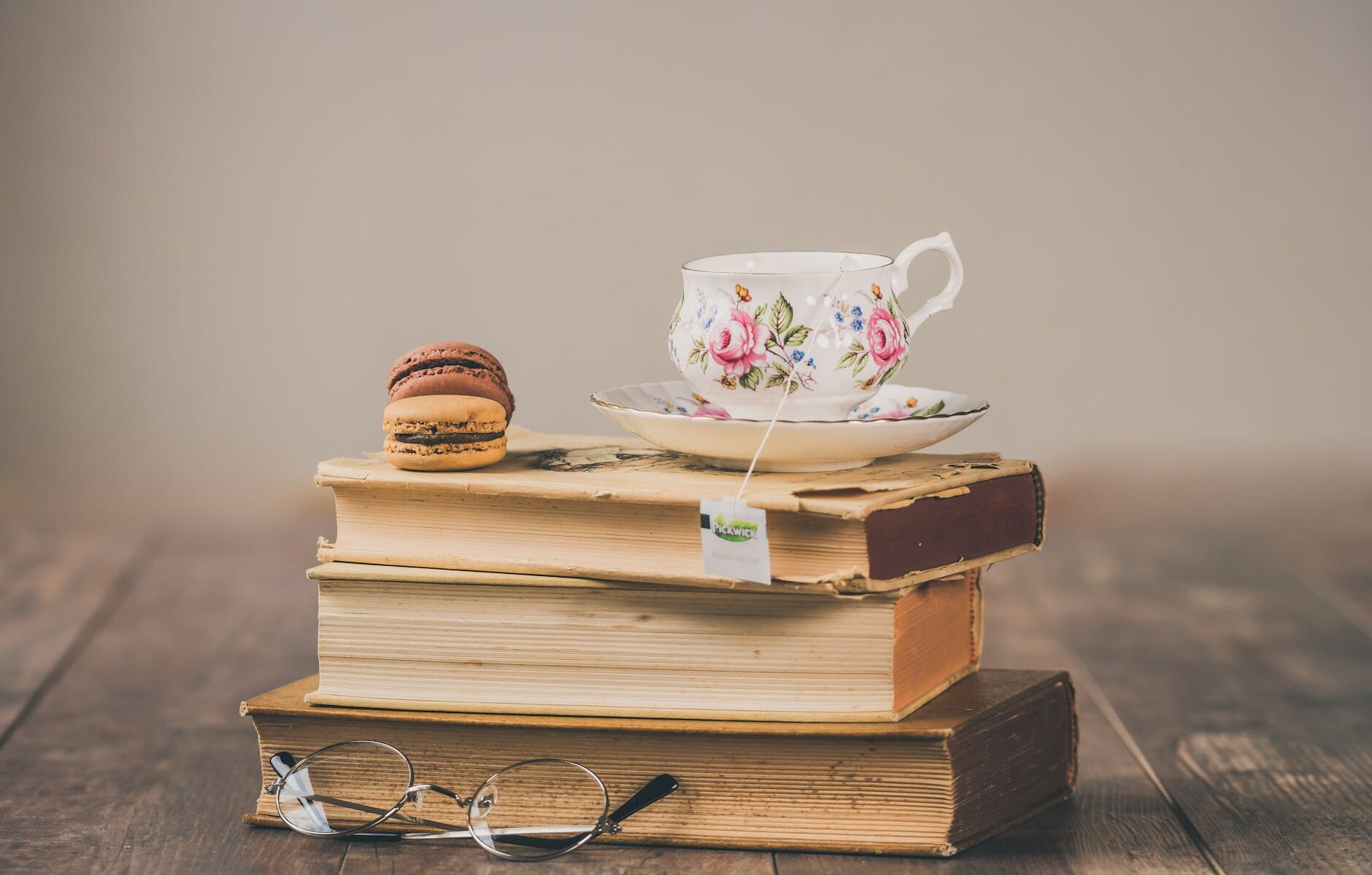 photo of teacup on top of books