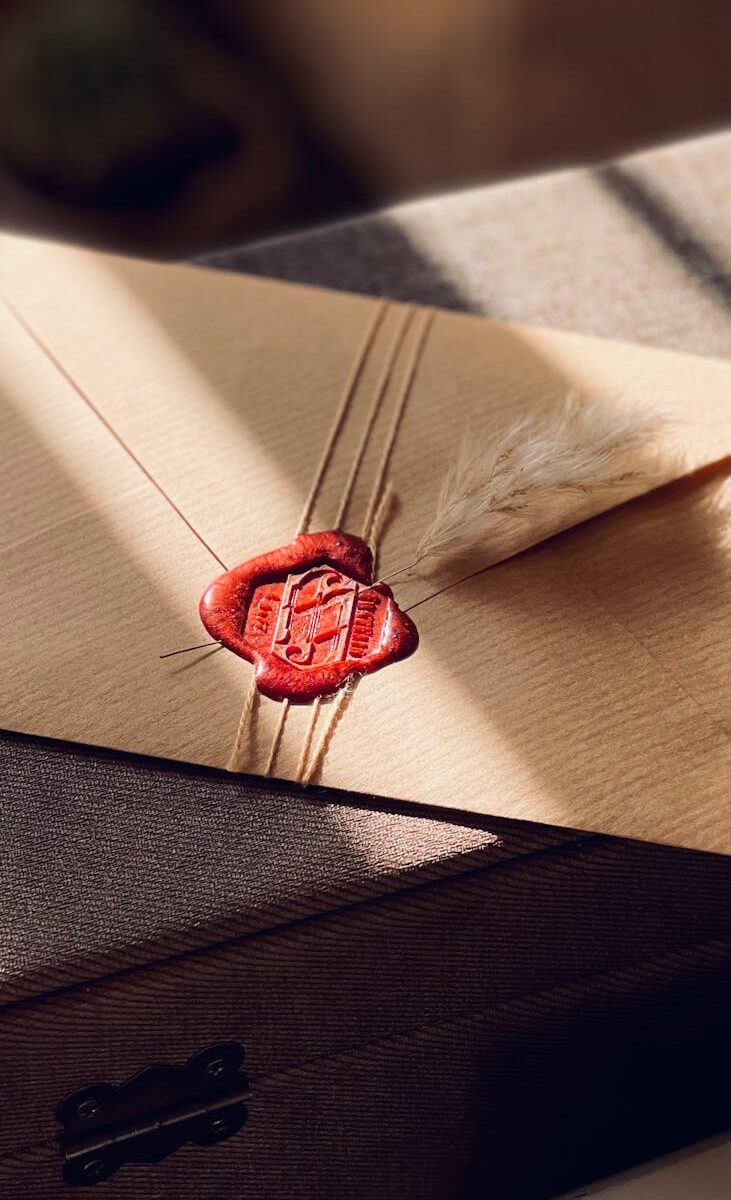 brown envelope with red wax seal