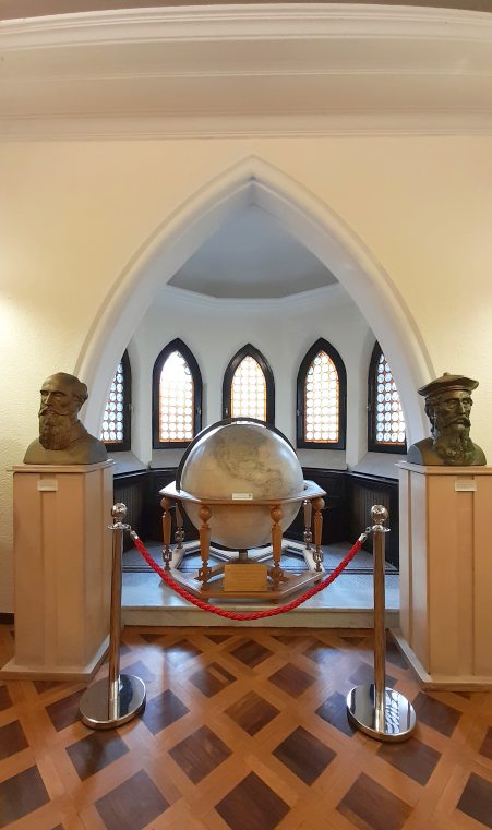 Map Museum Bucharest Renaissance Cartography Room, Earth globe flanked by busts of Claudius Ptolemy and Gerardus Mercator