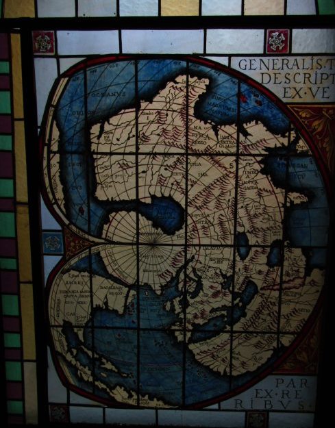 A stained glass window reproduction of a Renaissance double-cordiform (heart-shaped) 1531 world map by Oronce Fine